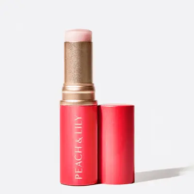 Pink Peach and Lily branded highlighter stick with the cap off