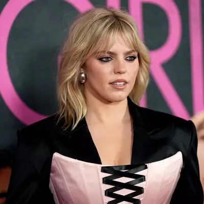 Renee Rapp wearing a pink corset and shag haircut at the 