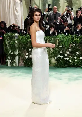 Kaia Gerber with voluminous hair in a strapless white gown at the 2024 Met Gala 
