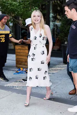 Dakota Fanning wearing a white dress in New York.