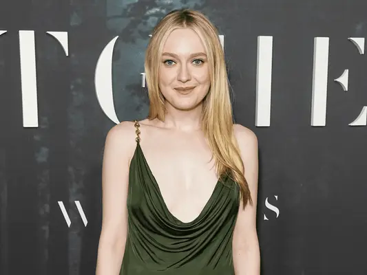 Dakota Fanning wearing a green dress.