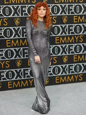 Natasha Lyonne wears a metallic gray Schiaparelli gown to the January 2024 Emmy Awards