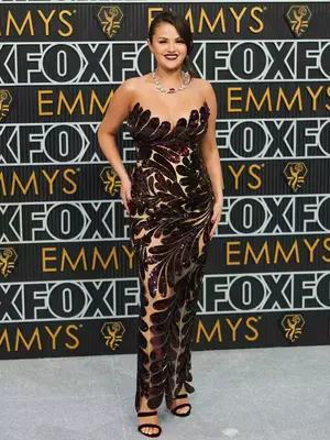 Selena Gomez wears an Oscar de la Renta gown with floral motif and Tiffany jewelry to the January 2024 Emmy Awards