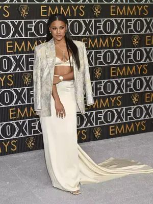 Ariana DeBose wears a Brunello Cucinelli blazer, bra, and skirt set, Omega watch, and De Beers Jewelry to the January 2024 Emmy Awards