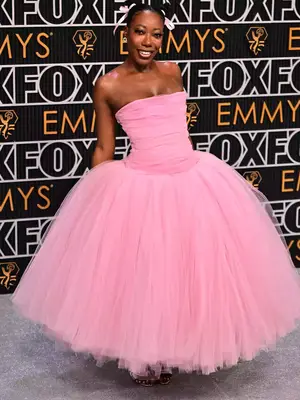 Alfie Fuller wears a pink tulle gown and pink hair ribbons to the January 2024 Emmy Awards