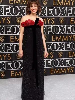 Beatrice Granno wears a sparkly black Armani gown with rose detailing to the January 2024 Emmy Awards