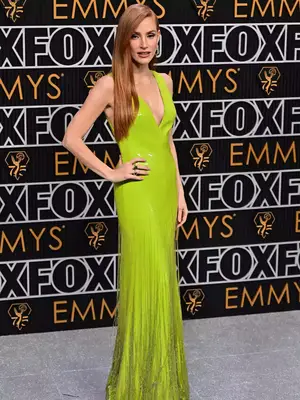 Jessica Chastain wears a lime green Gucci gown with plunge neckline to the January 2024 Emmy Awards