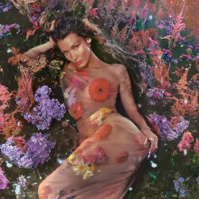 Bella Hadid in a bed of flowers