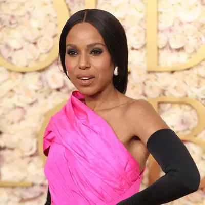 Kerry Washington in bright pink down and black smoky eye at golden globes
