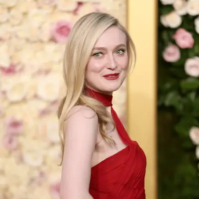 Dakota Fanning in a red lip and red dress at the golden globes