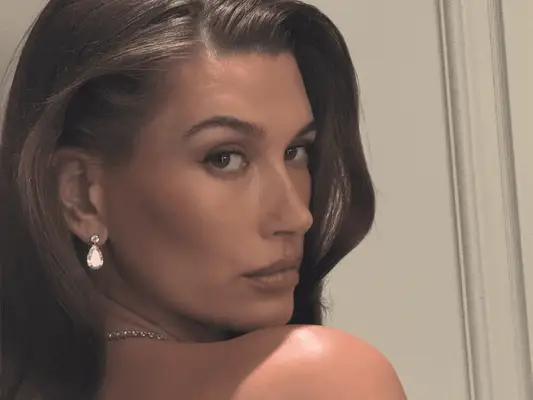 Hailey Bieber wearing a side-parted blowout to the 2025 Met Gala