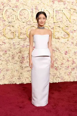 Anna Sawai at the 2025 Golden Globe Awards in a white column gown 