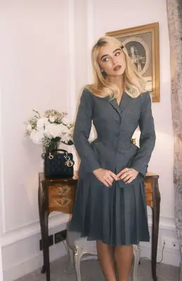 Sabrina Carpenter poses in an Instagram story with her hair side-parted and bangs hidden.