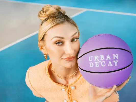 Cameron Brink holding a purple basketball