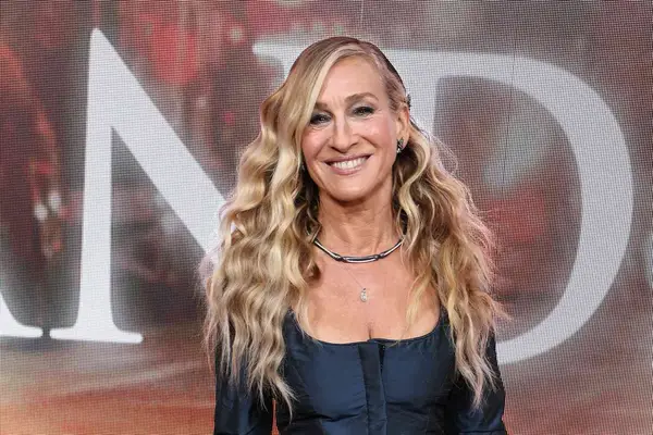 Sarah Jessica Parker smiles with her Carrie Bradshaw curls while attending Max Original