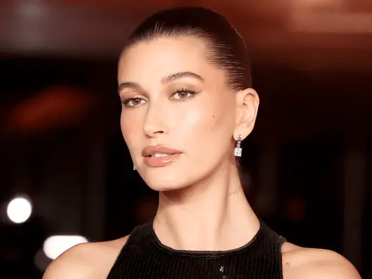 Hailey Bieber wearing a slicked-back bun.
