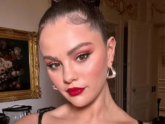 Selena Gomez wearing red lipstick and eyeshadow
