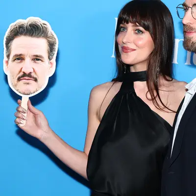 Dakota Johnson holding a Pedro Pascal cut-out