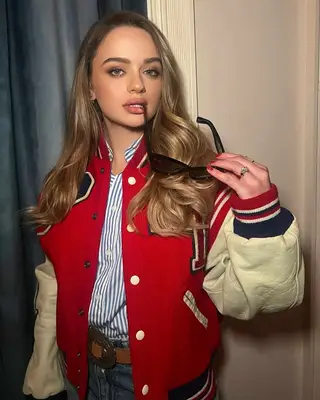 actor joey king in full glam wearing a baseball jacket