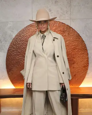 Beyonce in a tan outfit with tan nails