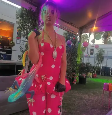 Addison Rae wearing a hot pink and white polka dot catsuit during Coachella weekend two.
