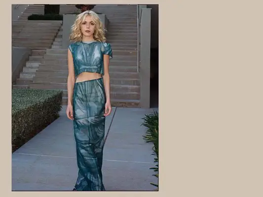 Kiernan Shipka wearing a blue skirt set.