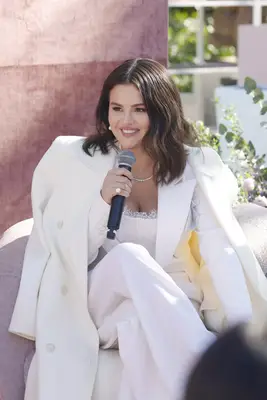 Selena Gomez wearing a white dress