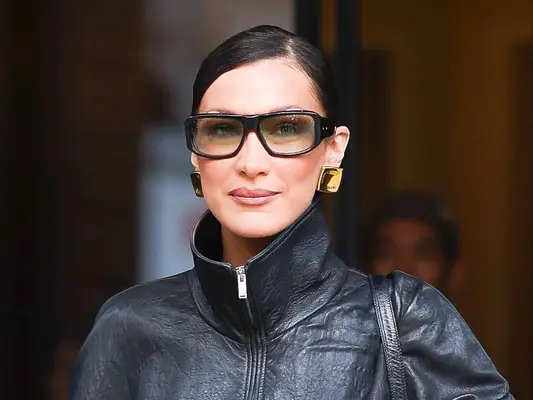 Bella Hadid wearing her hair dark and slicked back.