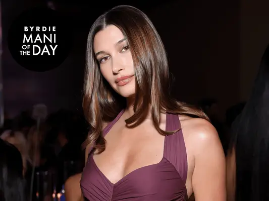 Hailey Bieber wearing a purple gown