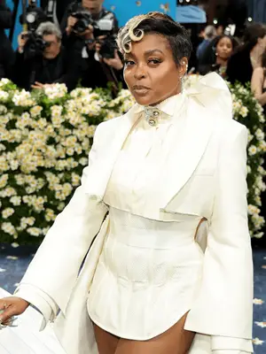 Taraji P. Henson wearing white suit and short haircut with blonde highlights