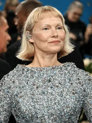 Pamela Anderson at the 2025 Met Gala wearing bob and baby bangs