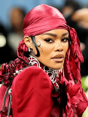 Teyana Taylor at the 2025 Met Gala wearing red silky durag
