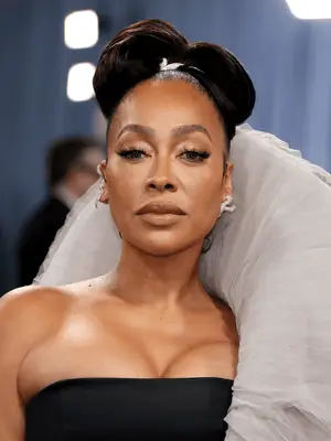 lala anthony at the 2025 met gala wearing polished updo and glamorous makeup