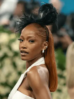 Keke Palmer at the 2025 Met Gala wearing half cornrow, half straight style