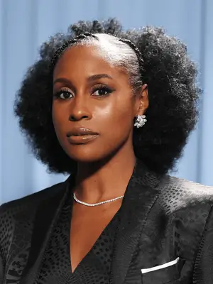 Issa Rae wearing afro hairstyle with braids