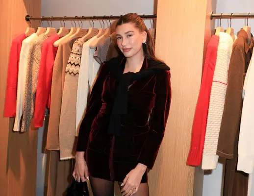 Hailey Bieber wearing red at the Guest In Residence store