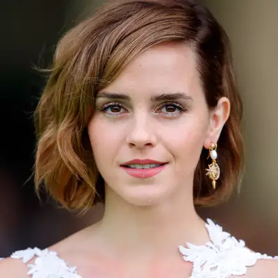 Emma Watson with freckles and glitter eyeshadow