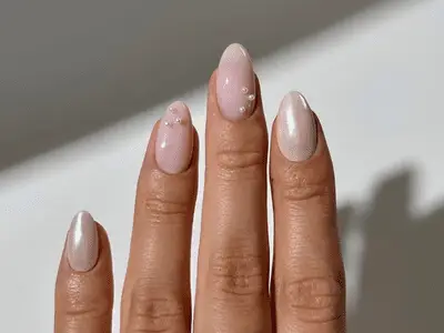 A set of fruit skin nails painted to look like a realistic fig or kiwi.