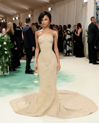 Tyla wears an hourglass-inspired gown and carries an hourglass to the 2024 Met Gala