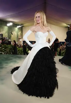 Nicole Kidman wears a black and white gown with tulle skirt and structured bodice to the 2024 Met Gala