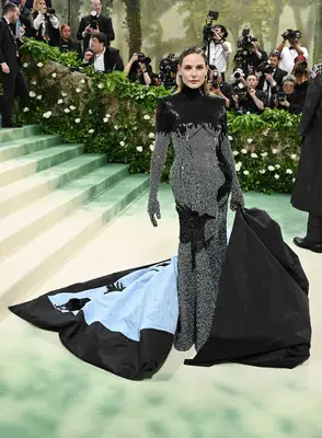 Rebecca Ferguson wears a Thom Browne dress and cape to the 2024 Met Gala