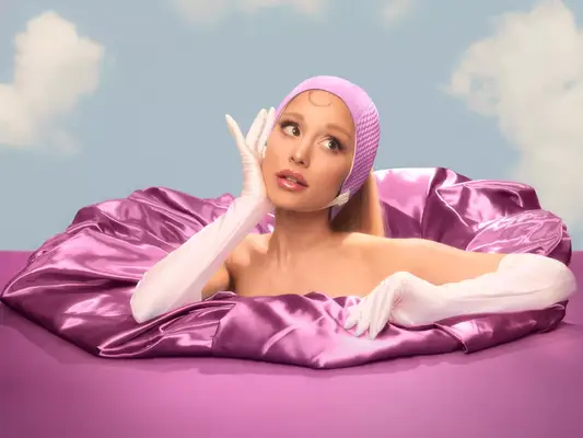 Ariana Grande wearing a swim cap