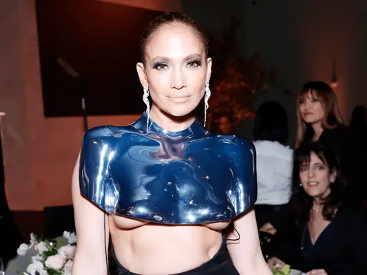 Jennifer Lopez wearing a silver chrome breastplate