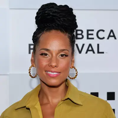 alicia keys in braided bun, gold hoop earrings and olive top 