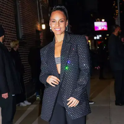 alicia keys in black diamante jacket and silver hoop earrings with ponytail