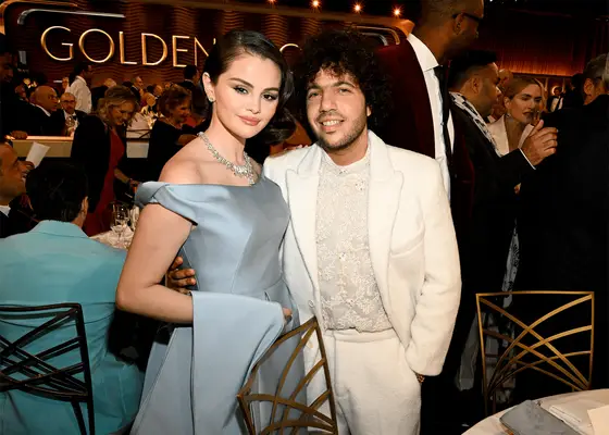 selena gomez and benny blanco posing at golden globes