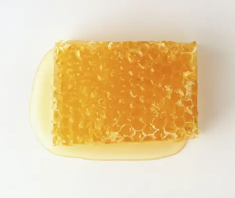 An open tin of vaseline on grey background