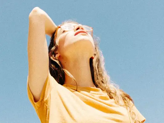 woman looking up at sky