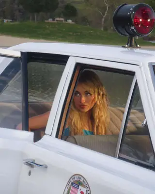 Sabrina Carpenter in the back of a boat