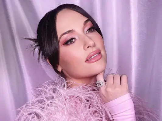 Casey Musgraves in an all pink outfit with pink eyeshadow